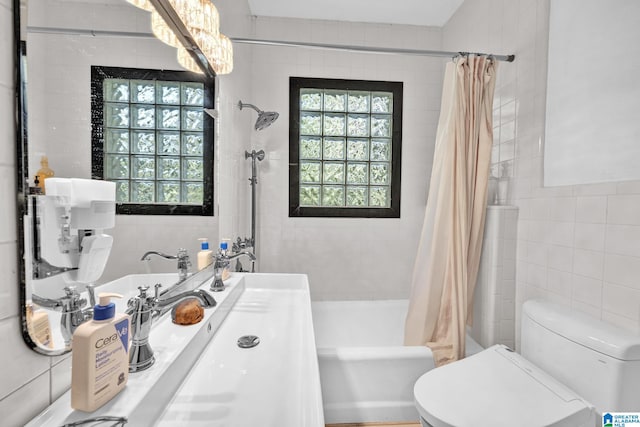 full bathroom with vanity, tile walls, shower / bath combination with curtain, and toilet