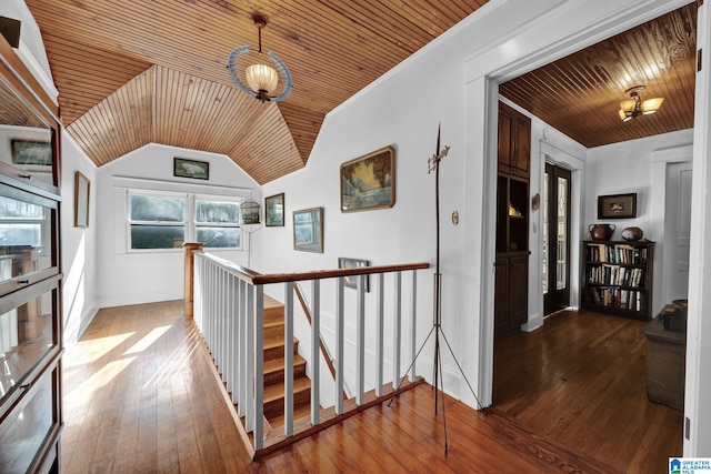 hall with lofted ceiling, wood ceiling, and hardwood / wood-style flooring