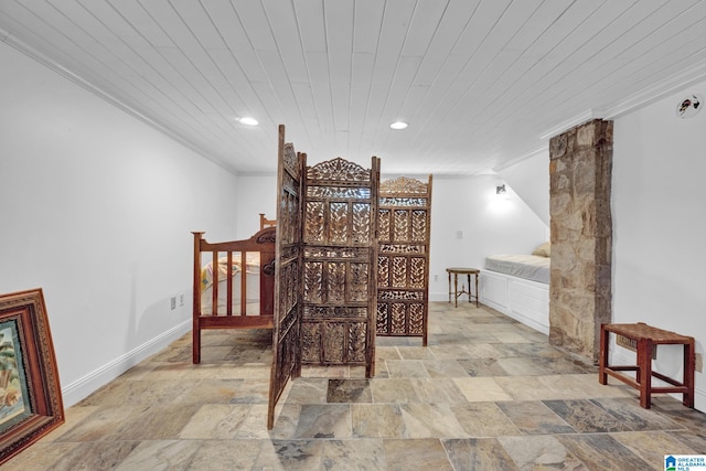 bedroom featuring crown molding, vaulted ceiling, and wood ceiling