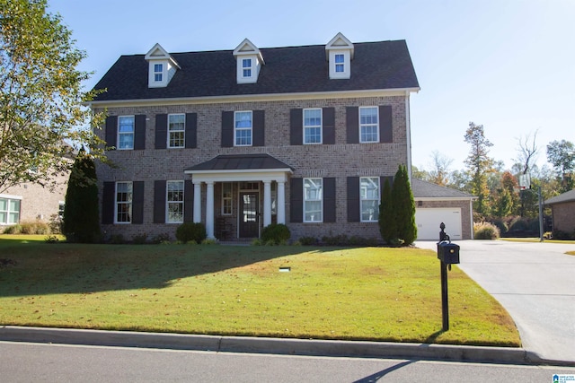 colonial-style house with a front lawn and a garage