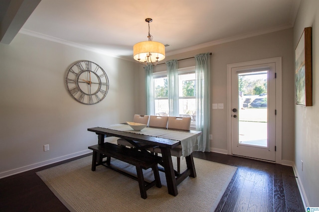 dining area with crown molding and dark hardwood / wood-style floors