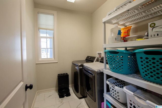 washroom with independent washer and dryer