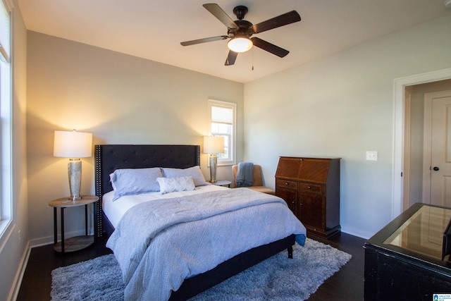 bedroom with dark wood-type flooring and ceiling fan