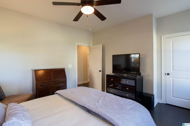 bedroom featuring ceiling fan and dark hardwood / wood-style flooring