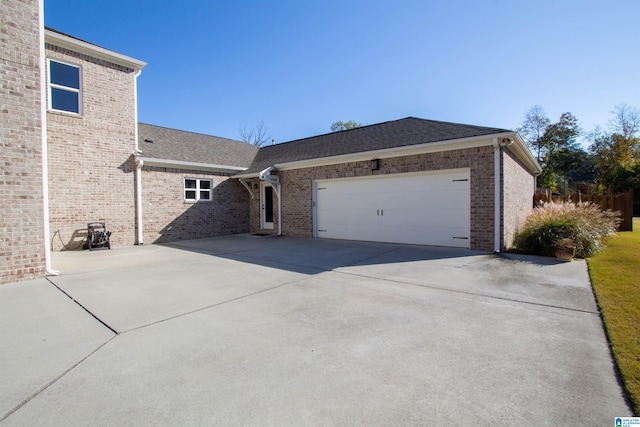 view of property exterior featuring a garage