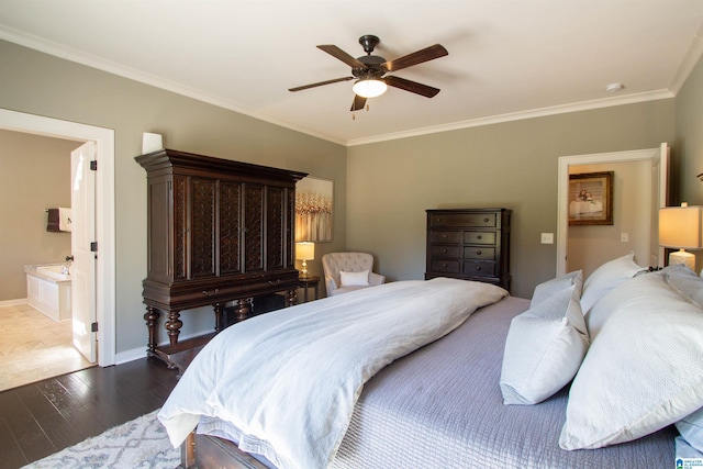 bedroom featuring ornamental molding, dark hardwood / wood-style floors, connected bathroom, and ceiling fan