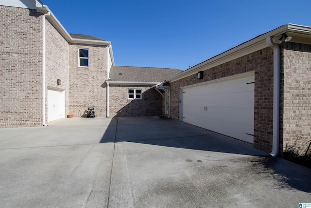 view of side of property featuring a garage