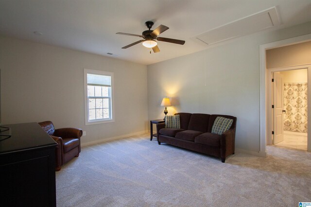 carpeted living room featuring ceiling fan