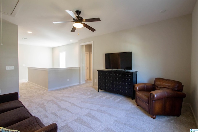 living room featuring light colored carpet and ceiling fan