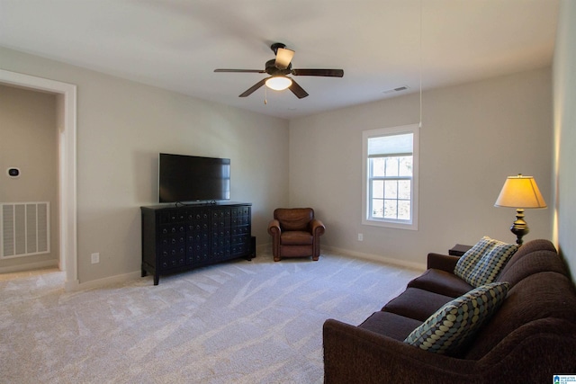 living room featuring light carpet and ceiling fan