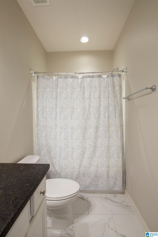 bathroom with vanity, toilet, and a shower with shower curtain