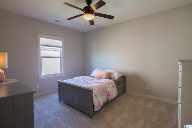 bedroom featuring ceiling fan and light carpet