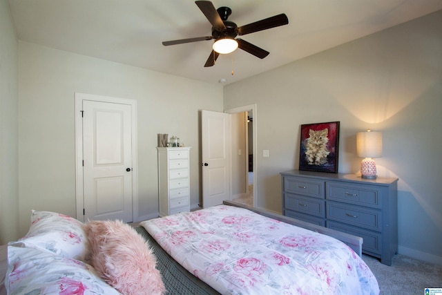 bedroom with ceiling fan and light carpet