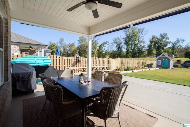 view of patio featuring a storage unit, an outdoor hangout area, and ceiling fan