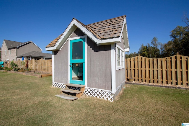 view of outbuilding featuring a yard