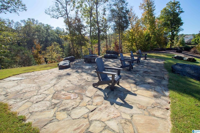 view of community with a patio and a lawn