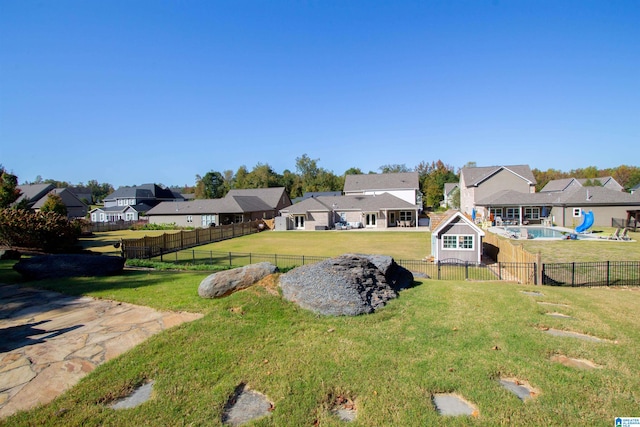 view of yard featuring a fenced in pool