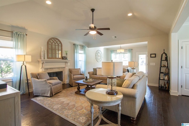 living room with ceiling fan, lofted ceiling, and dark hardwood / wood-style floors