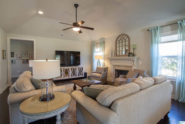 living room with lofted ceiling, dark wood-type flooring, and ceiling fan