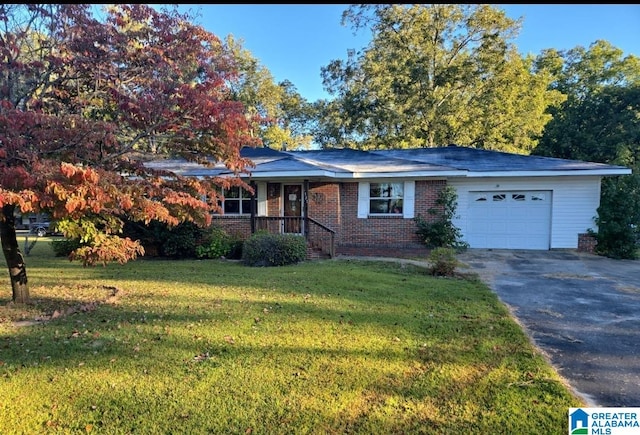 single story home with a garage and a front lawn