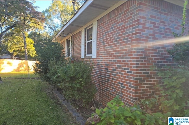 view of property exterior with a lawn