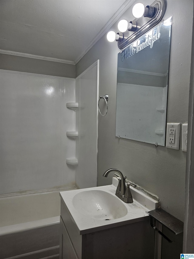 bathroom featuring vanity, ornamental molding, and tub / shower combination