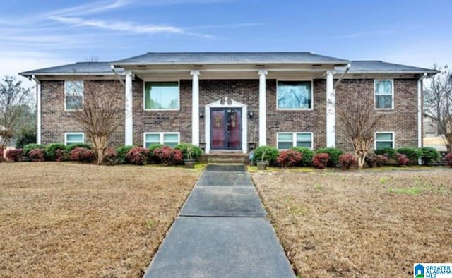 bi-level home with a front lawn