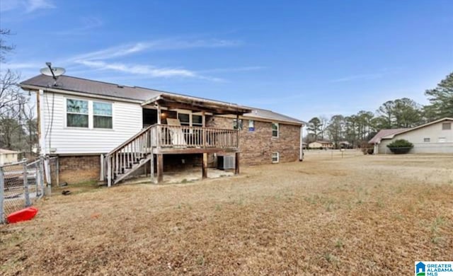 rear view of house with central AC unit