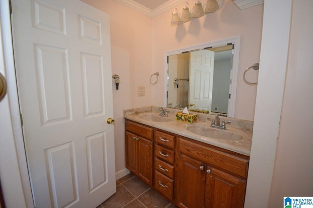 full bathroom featuring crown molding, double vanity, a sink, and tile patterned flooring