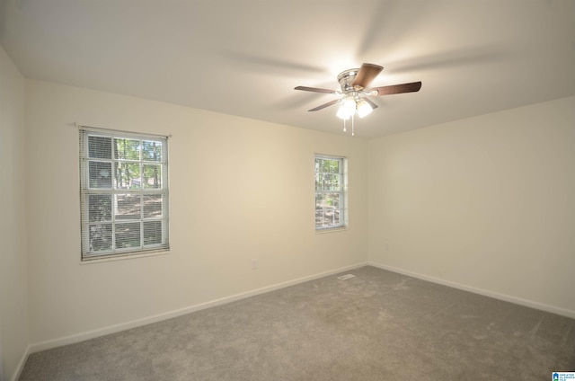 carpeted empty room with ceiling fan