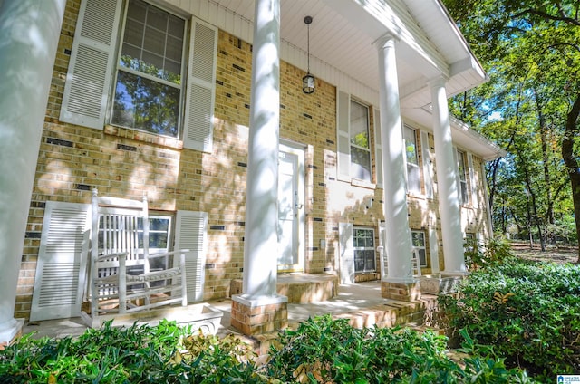 view of exterior entry featuring a porch