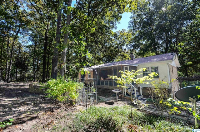 view of yard with a sunroom