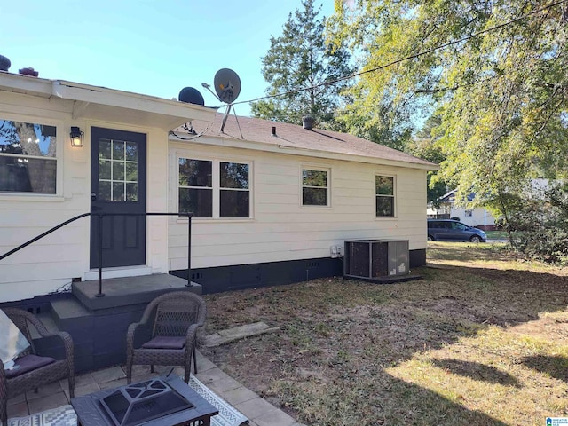 back of house with cooling unit