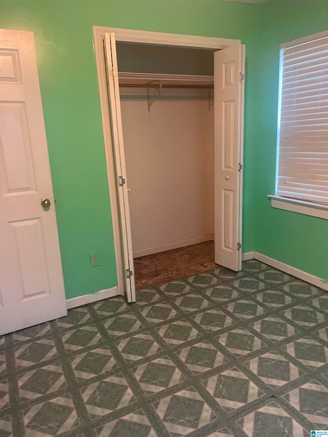 unfurnished bedroom with a closet