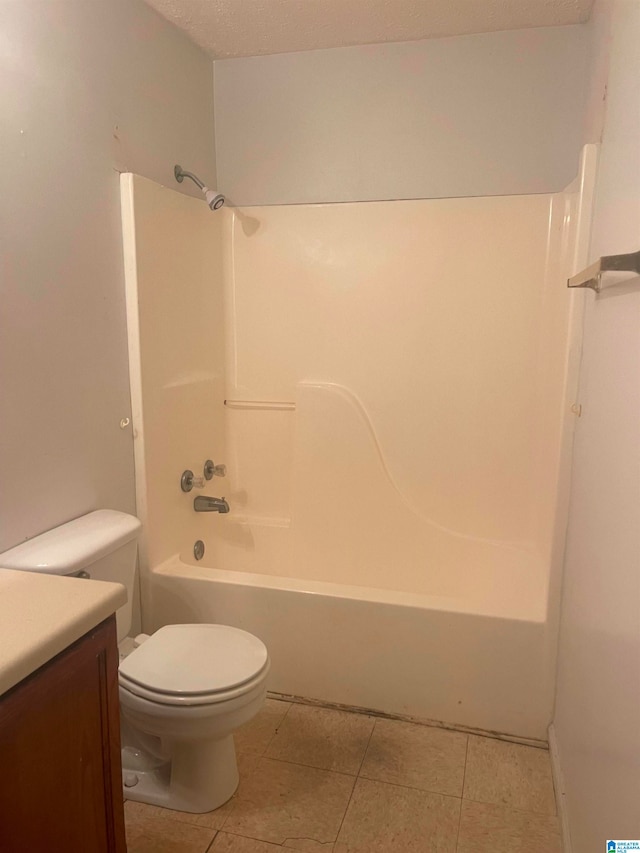 full bathroom featuring vanity, tile patterned flooring, toilet, and tub / shower combination