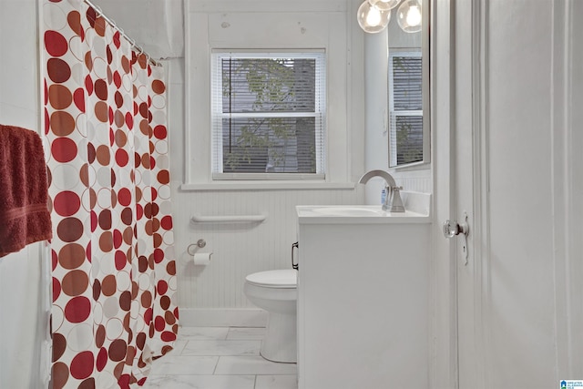 bathroom featuring vanity, a shower with shower curtain, toilet, and marble finish floor