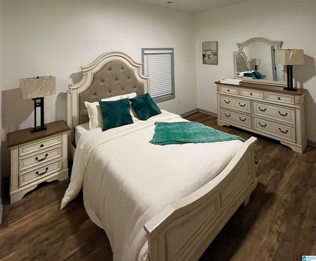 bedroom featuring dark hardwood / wood-style flooring