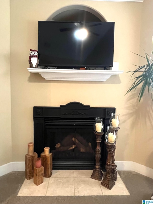 details featuring a fireplace and tile patterned flooring