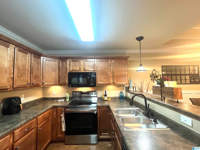 kitchen with sink, crown molding, electric range, and hanging light fixtures