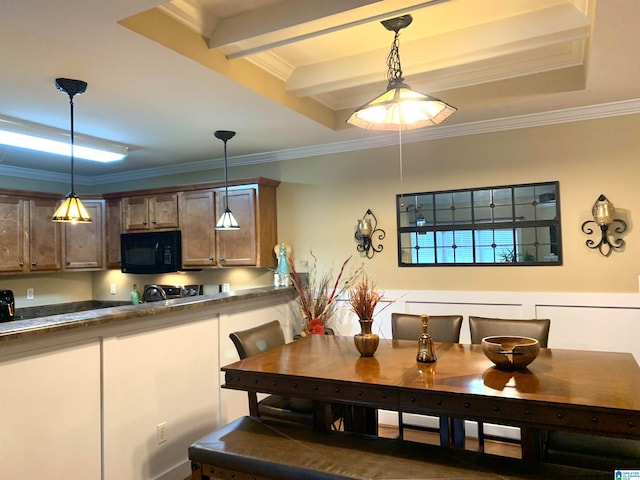 kitchen with crown molding, beam ceiling, and hanging light fixtures