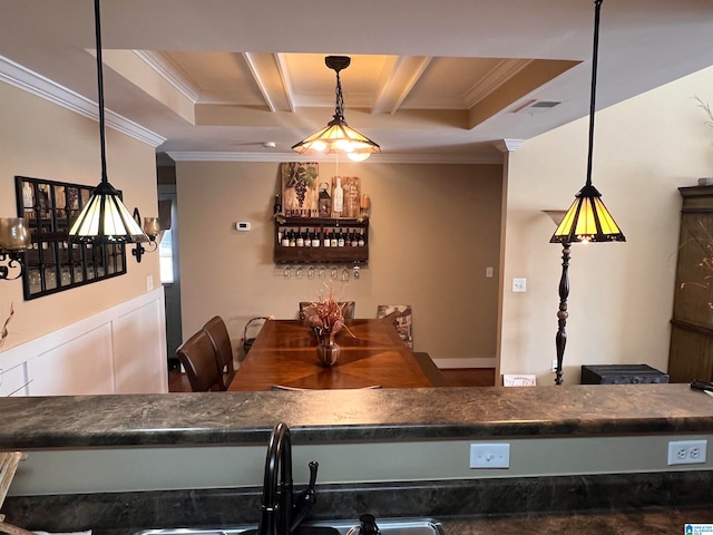 dining room with crown molding and sink