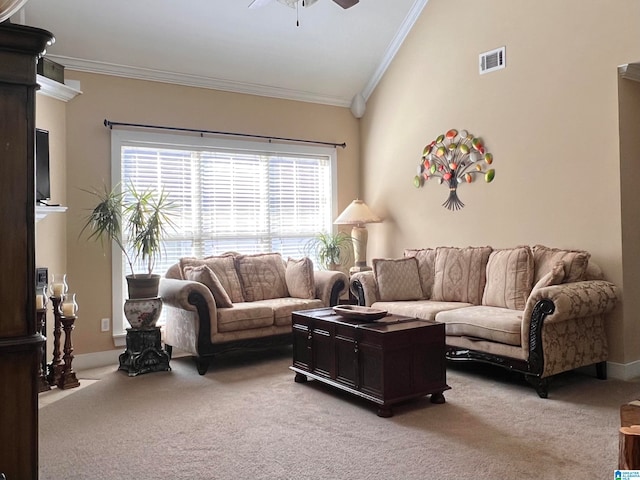 living room with crown molding, vaulted ceiling, light colored carpet, and ceiling fan