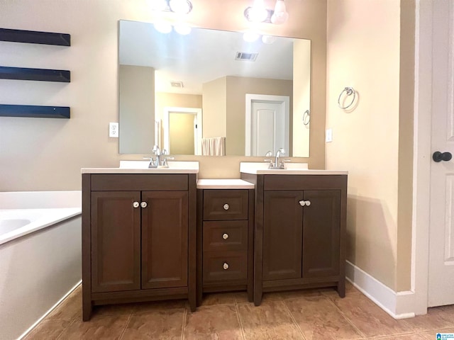 bathroom featuring vanity, a bathtub, and ceiling fan