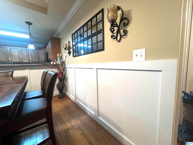 interior space with crown molding and dark hardwood / wood-style floors