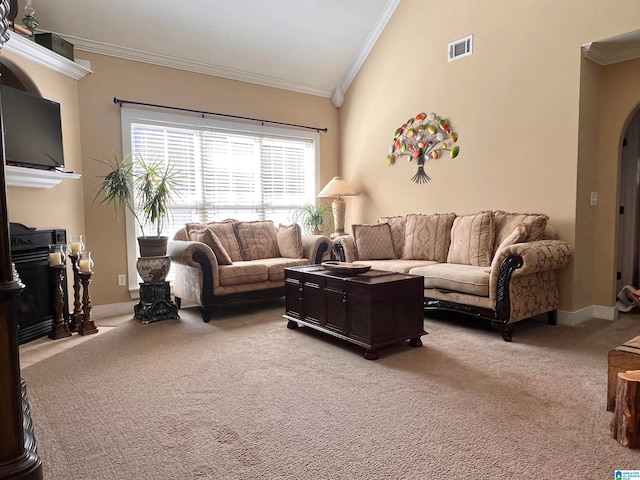 carpeted living room with ornamental molding and vaulted ceiling