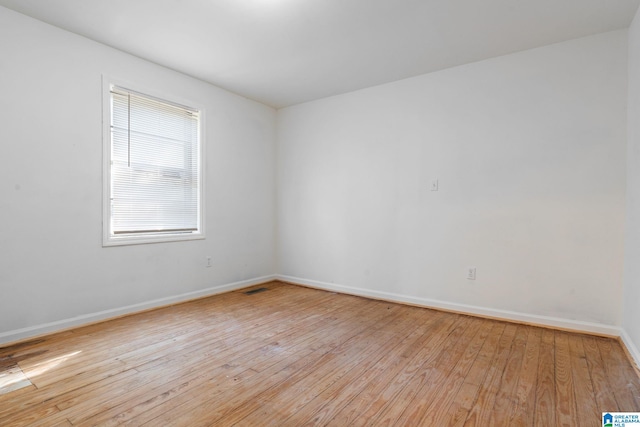 empty room with light hardwood / wood-style floors