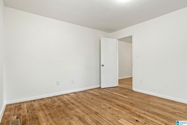 spare room featuring light wood-type flooring