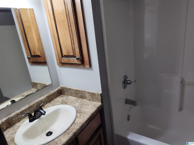 bathroom featuring vanity and washtub / shower combination