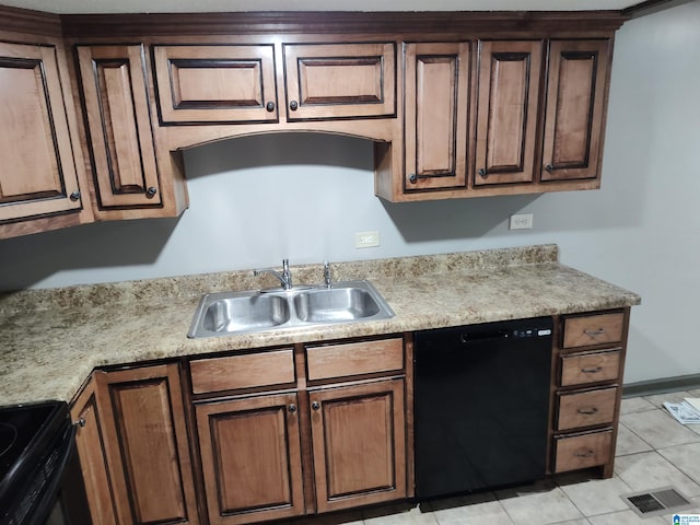 kitchen featuring sink, black appliances, and light tile patterned flooring