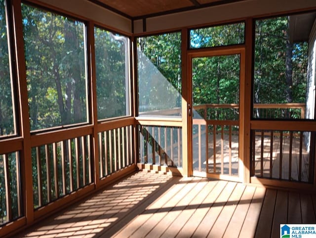 unfurnished sunroom featuring a healthy amount of sunlight